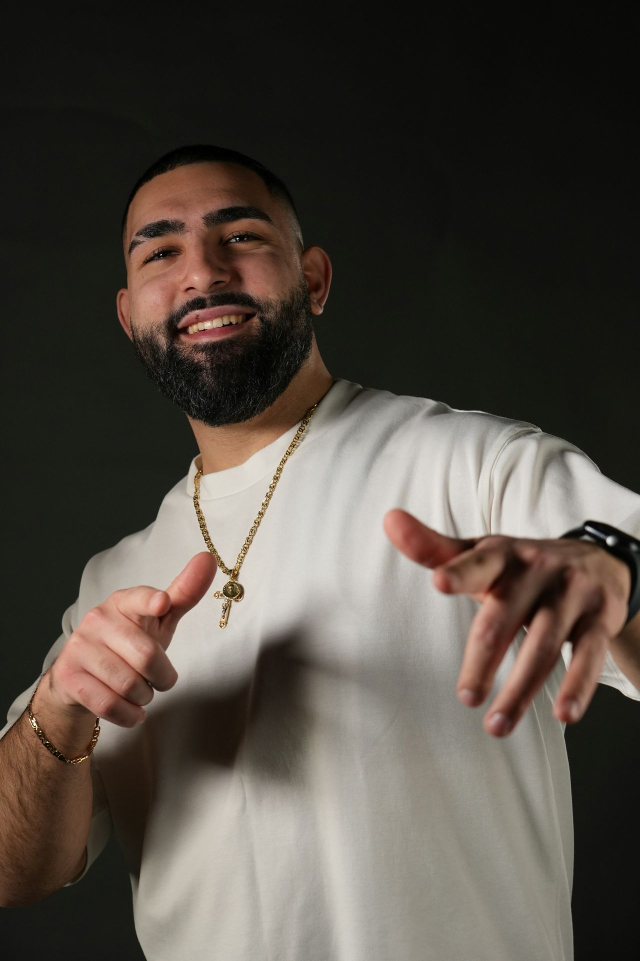 A man in a white shirt pointing at something